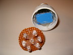 The LEDs are soldered to a piece of perf. board cut to fit into the old CFL casing.